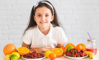 fresh-organic-fruits-front-happy-girl