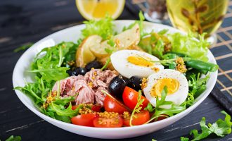 healthy-hearty-salad-tuna-green-beans-tomatoes-eggs-potatoes-black-olives-close-up-bowl-table